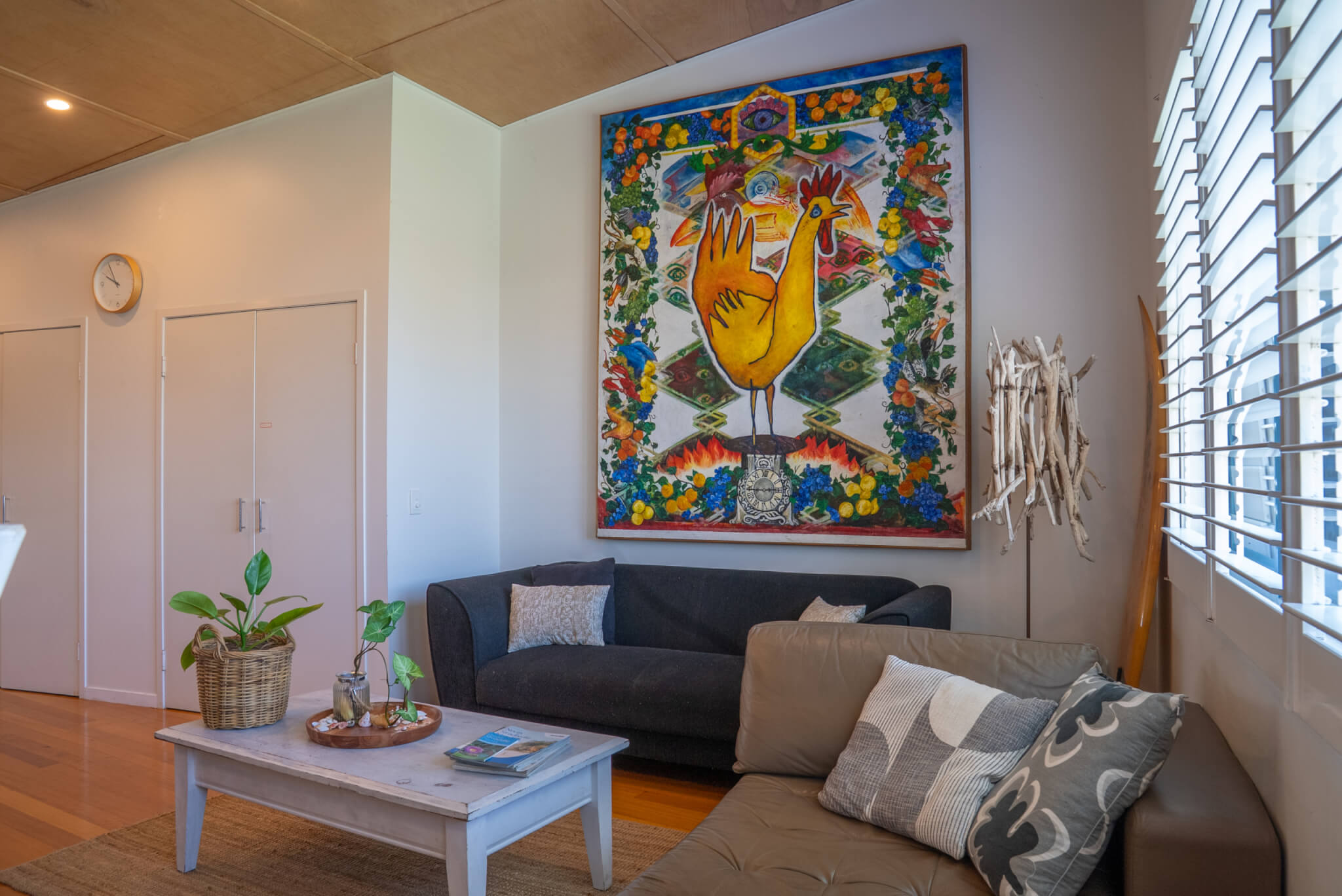 Holiday living area with beach wall décor and soft lounge