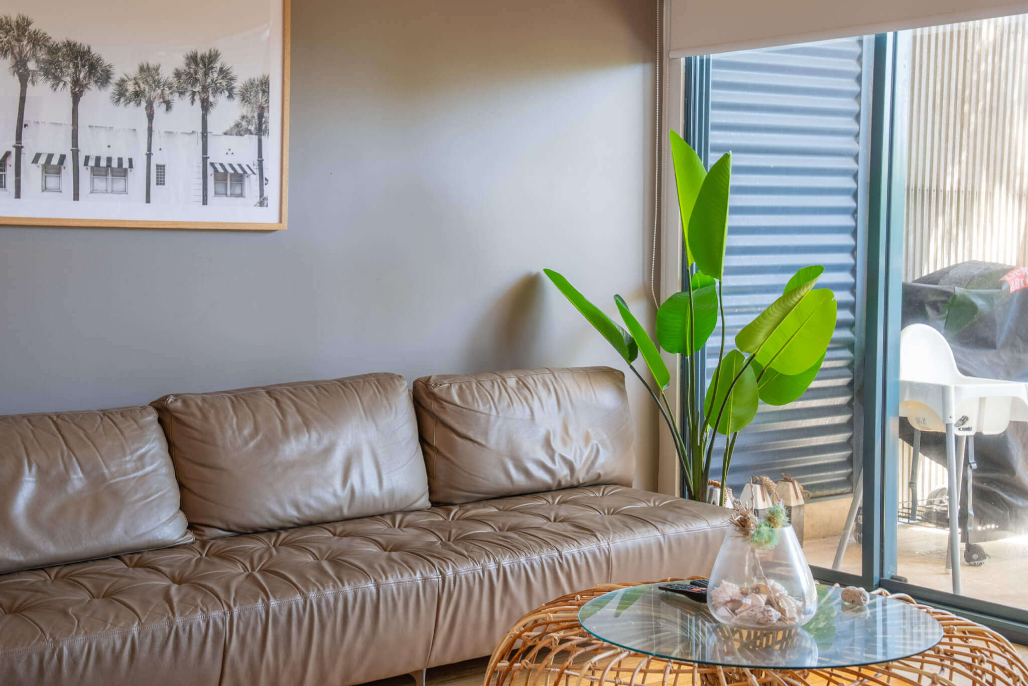 Comfortable lounge with beach photos and island-inspired styling