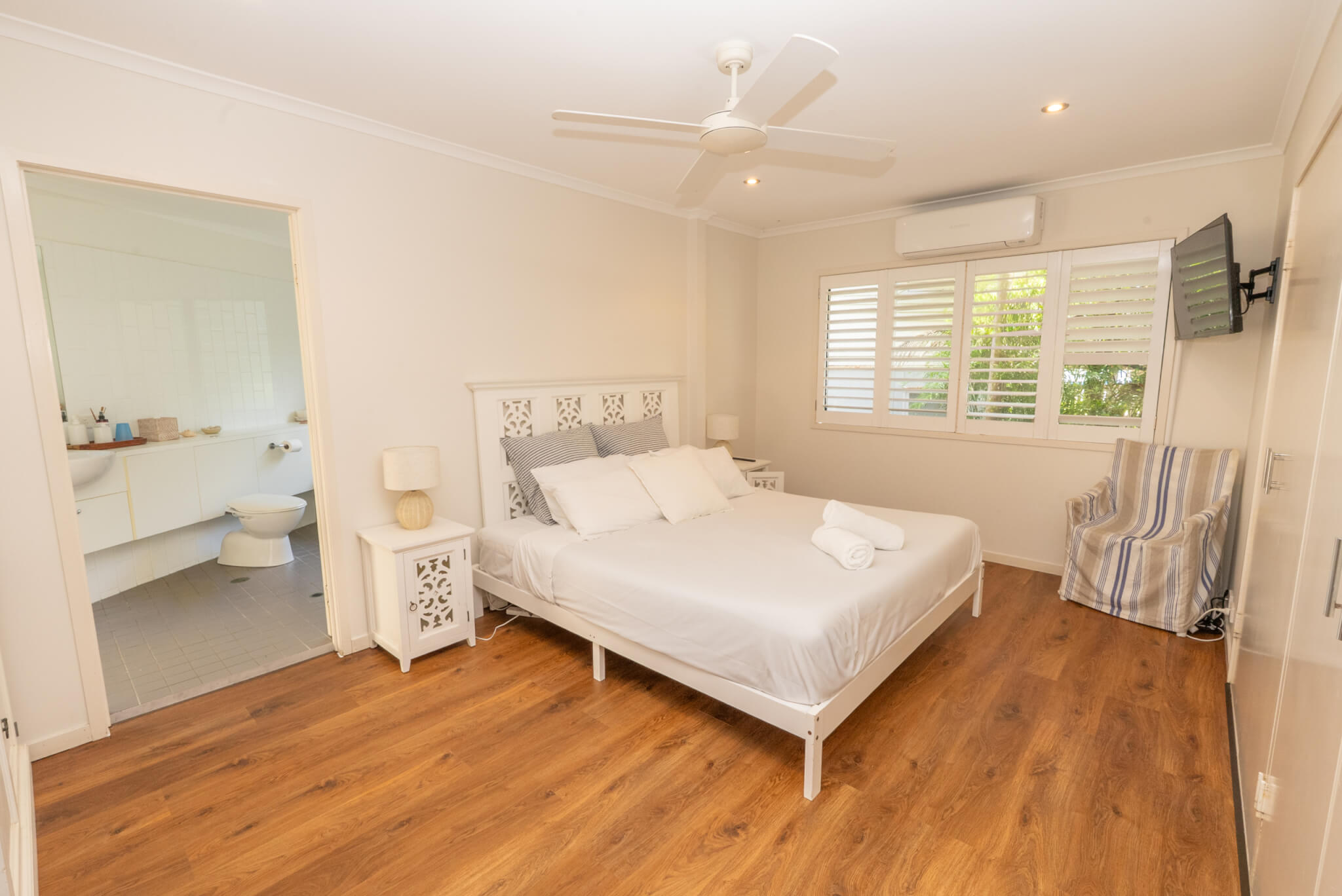 Holiday bedroom with comfortable bedding and storage