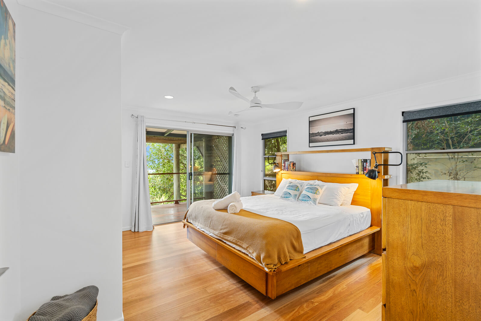 Spacious bedroom with large windows and neutral tones