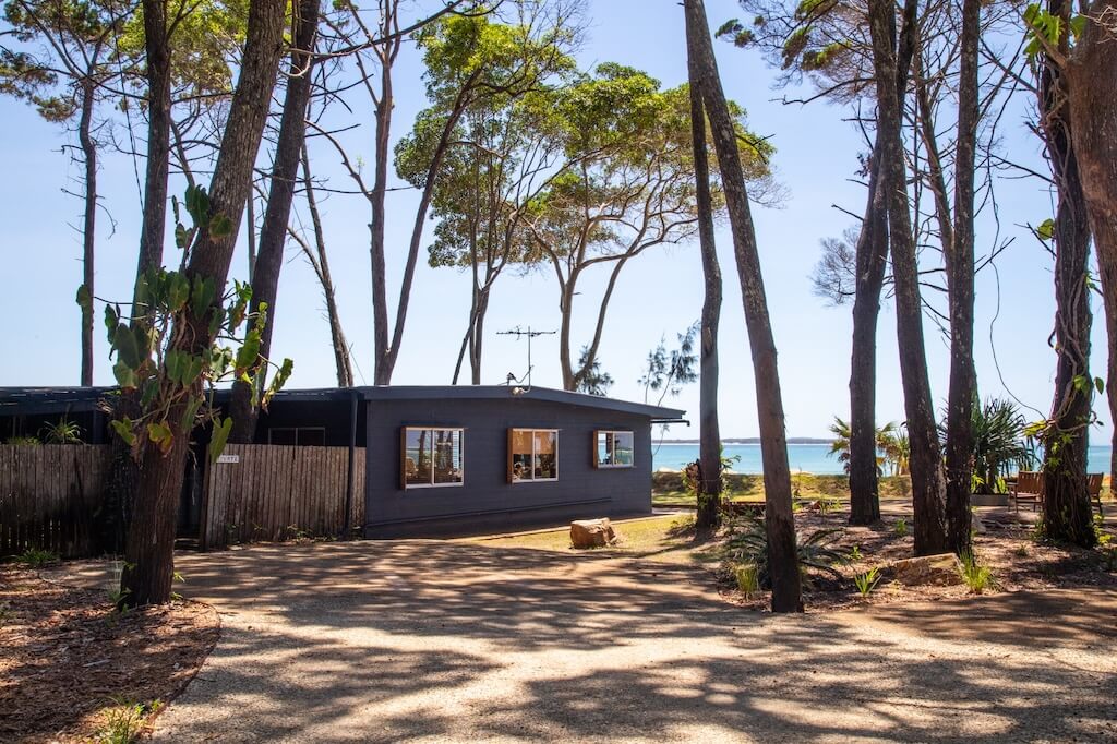 Old Ballow Coastal home among tall trees