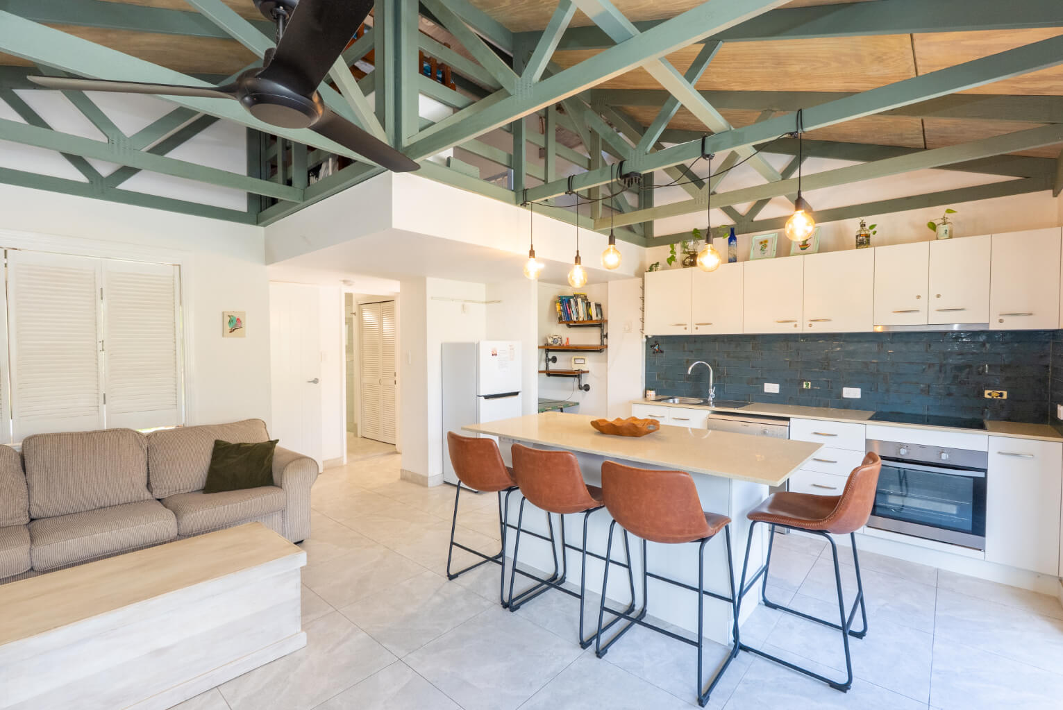 Kitchen and dining space with table and modern appliances