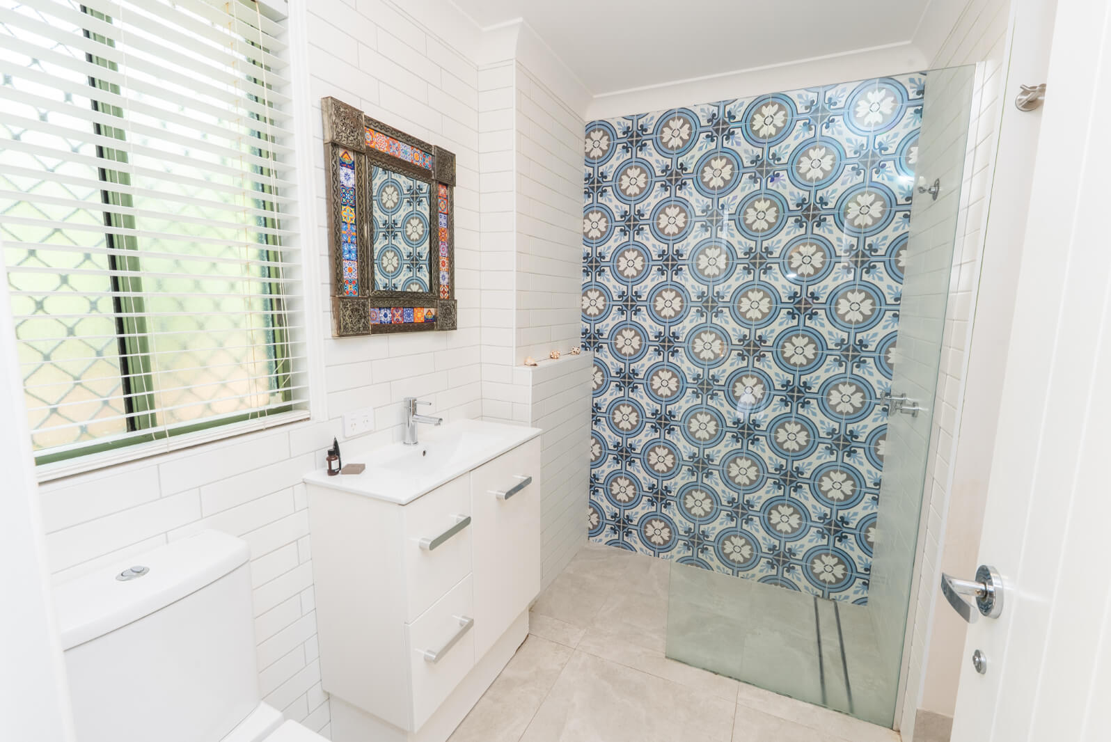 Bright white bathroom with neat tiled finish