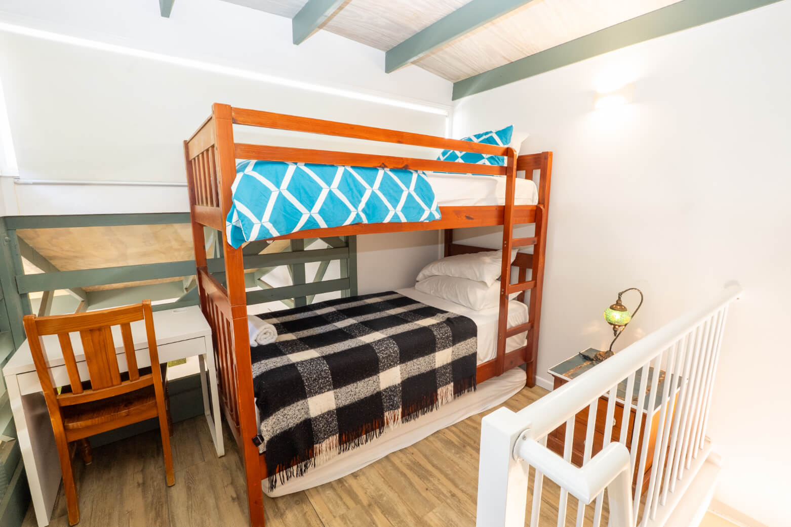 Bright bunk room with double deck bed and clean styling