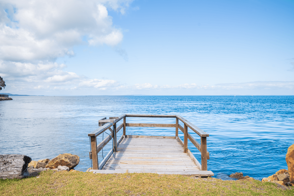 Coastal home accommodation beach access boardwalk Point Lookout
