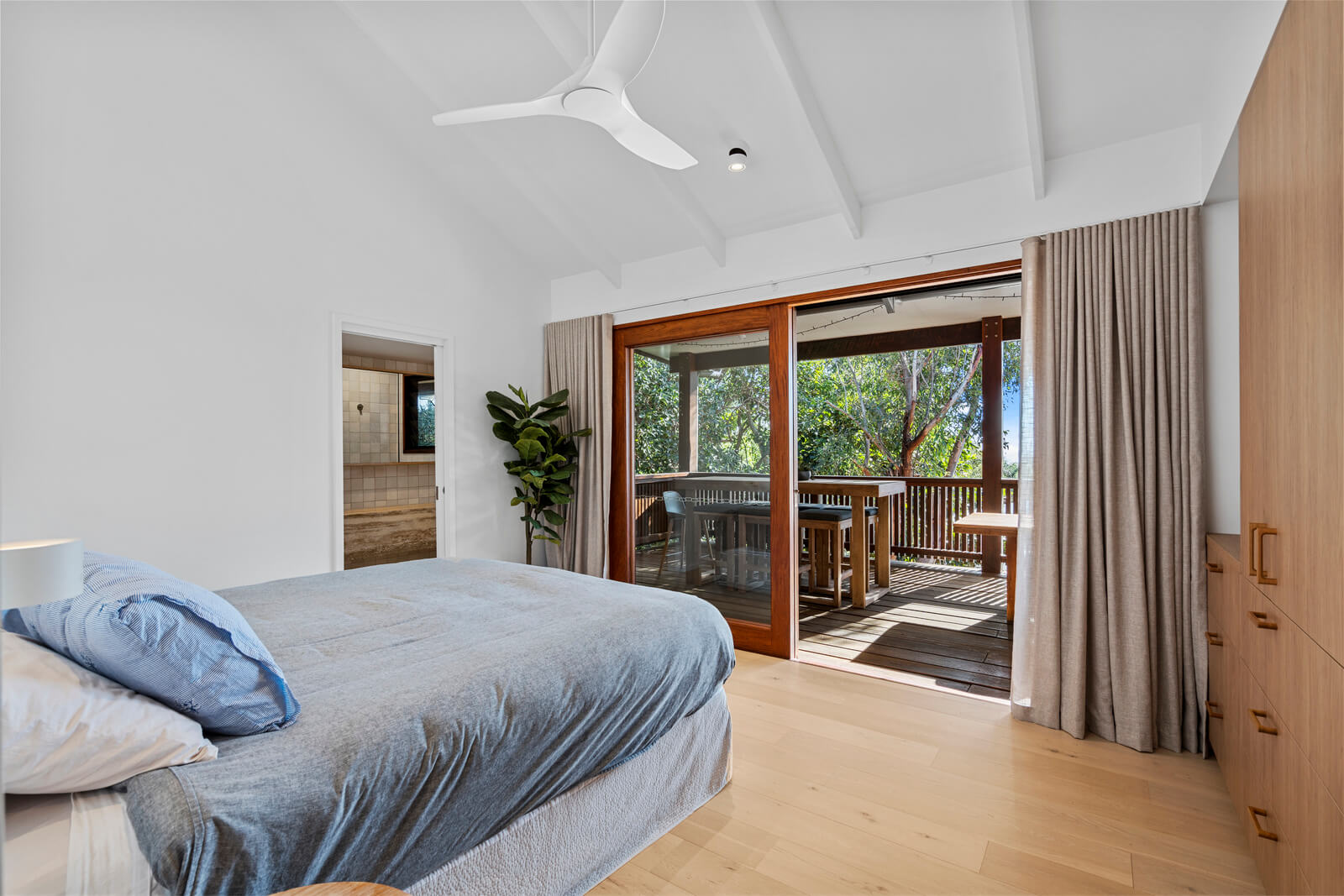 Coastal home accommodation bedroom with balcony Point Lookout