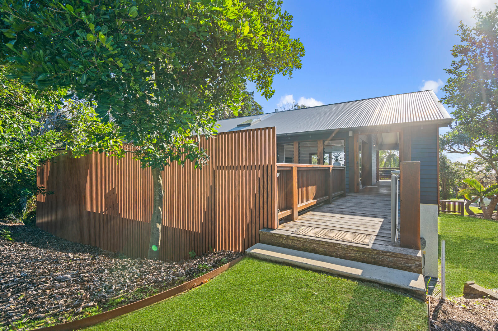 Coastal home accommodation landscaped outdoor area Point Lookout