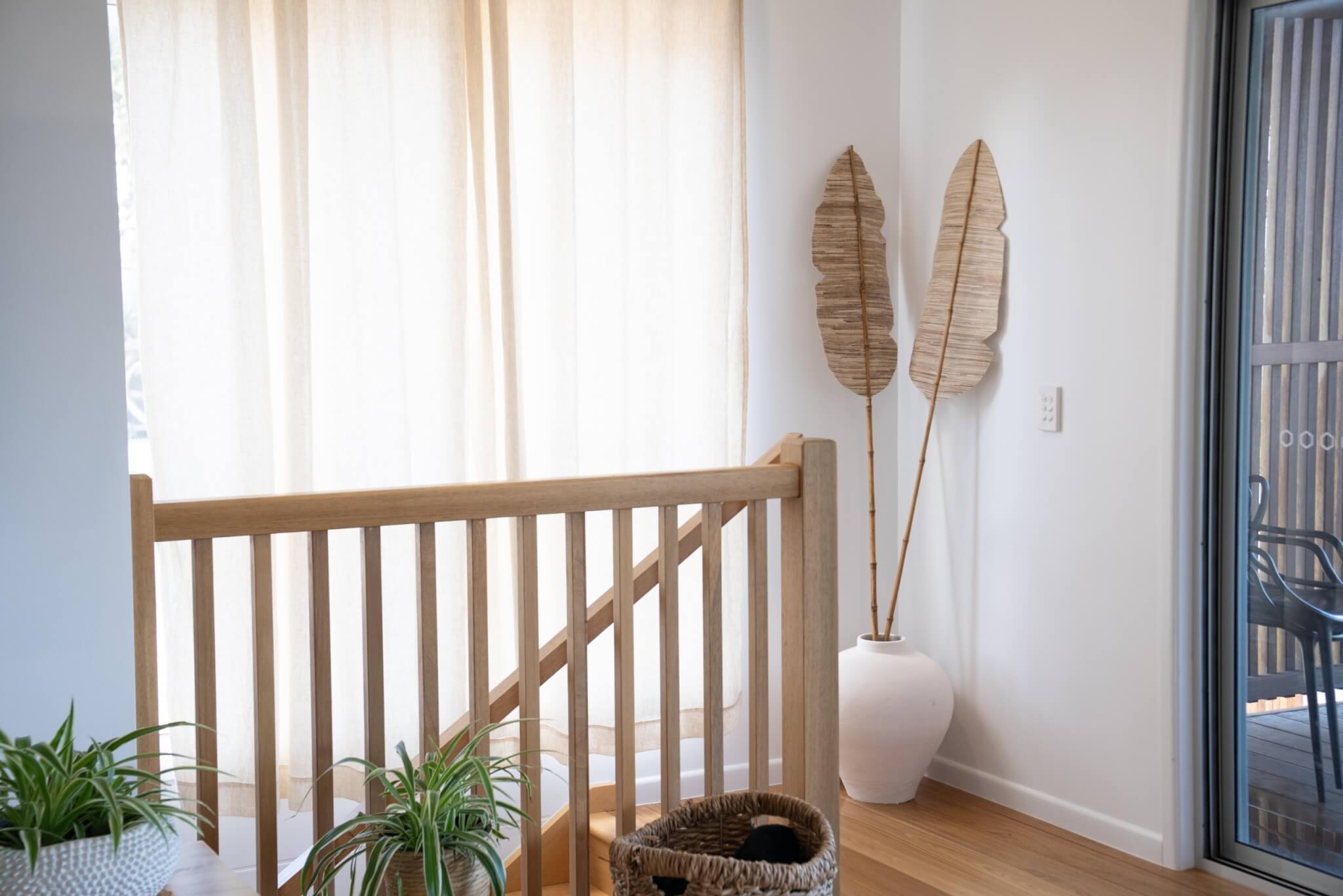 Coastal home accommodation staircase landing Stradbroke Island