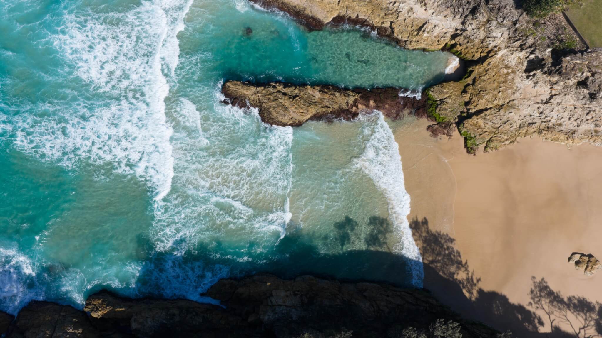 Coastal home accommodation beachside rock pools Straddie